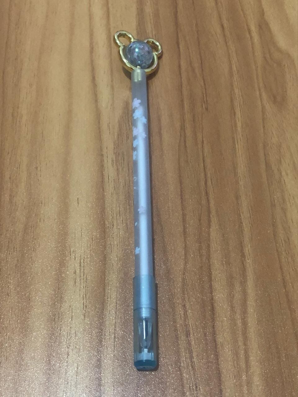 Caneta ponta Urso com esfera Giratória azul