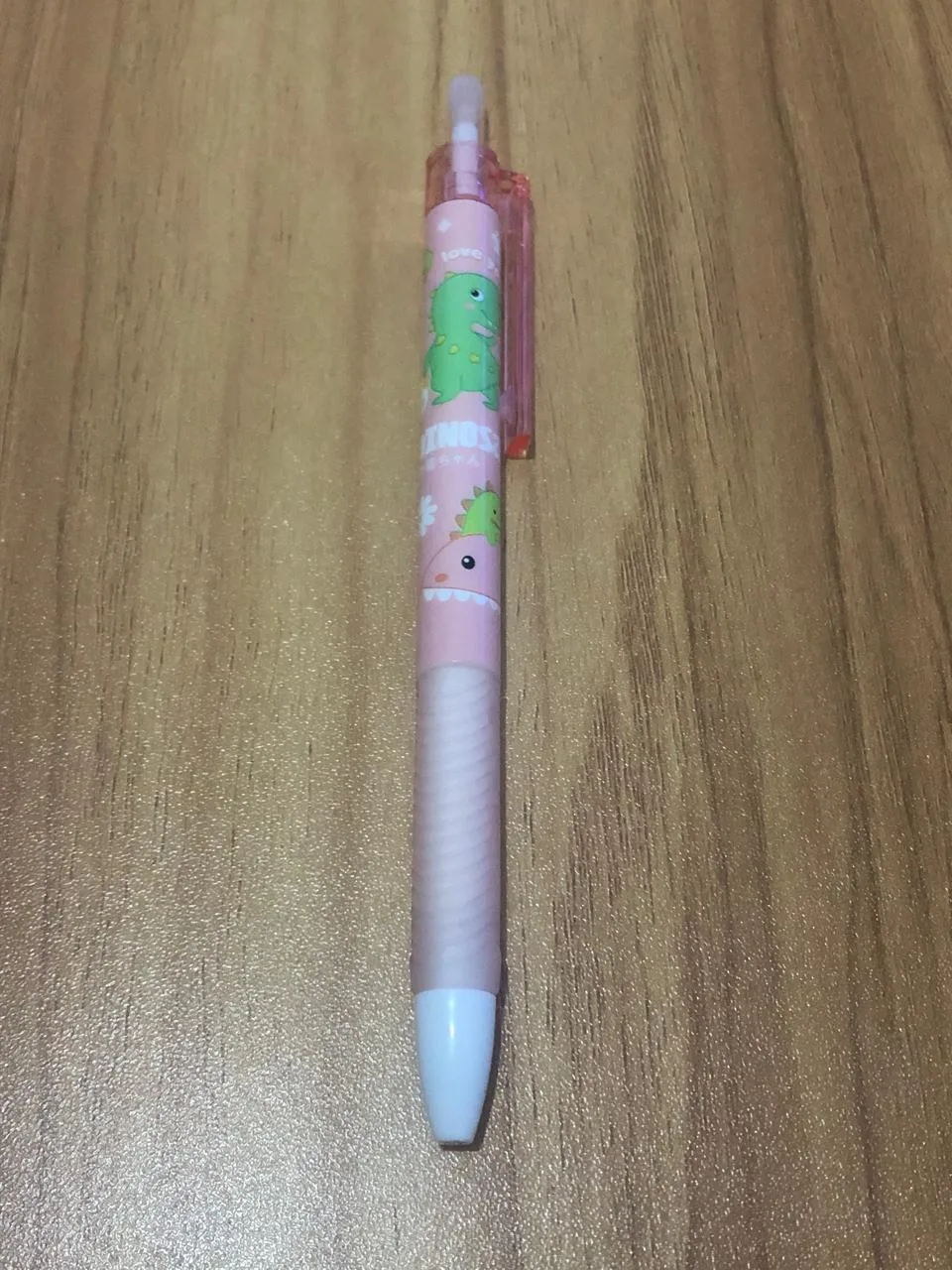 Caneta estampa dinossauro rosa claro